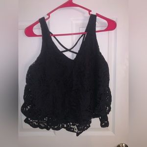 Really cute Black lace tank top but not see through, has criss cross in the back